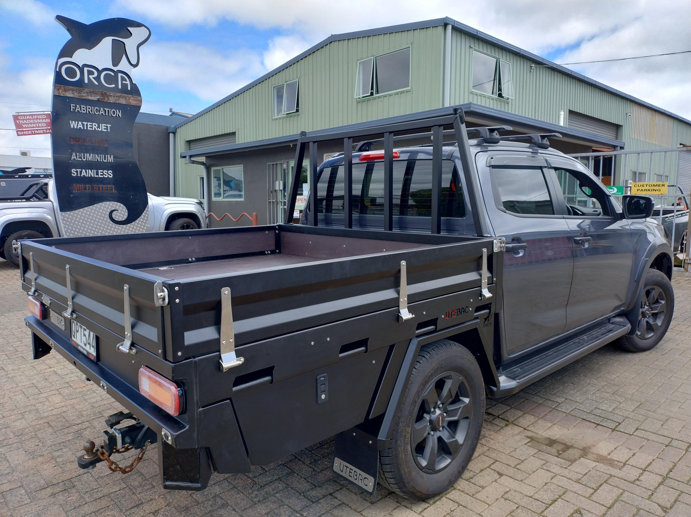 UTEBAC Flat Deck showing aluminum deck with side and tail gates